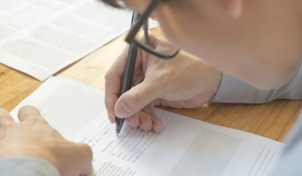 Man write in application form Man write in application form